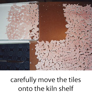 loading sections of the glazed tiles onto the kiln shelf